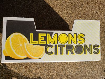 A cardboard box for bulk lemons